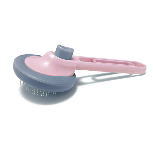 A pet comb with a button to remove the hair on it easily